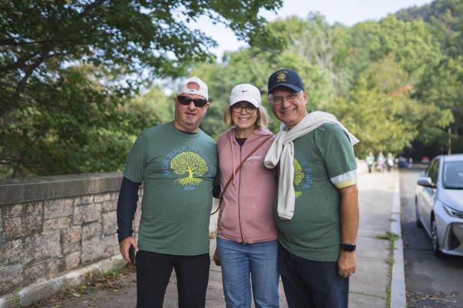 Group of walkers poses for a photo on the walk route.